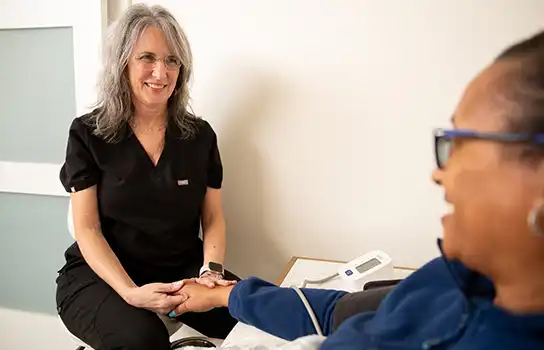 Nurse speaking to patient